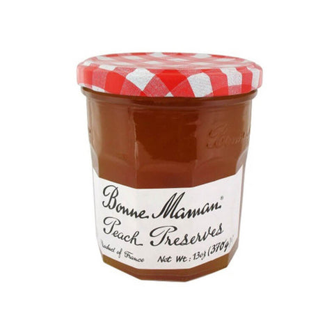 Glass jar of Peach Preserves from the Bonne Maman brand, front view.