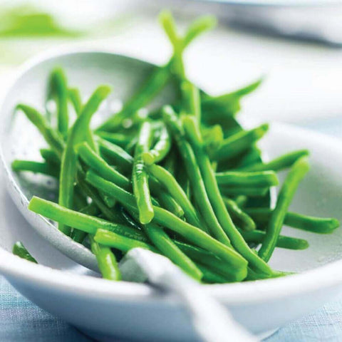 Extra Fine Green Beans placed in a bowl, front view.