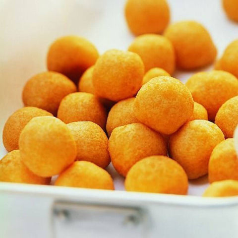 Assorted Nut Potatoes, laid on marble, front view.