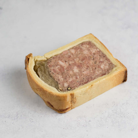 P??t?? en Croute on marble, side view.