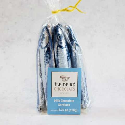Milk Chocolate Sardine of the brand Ile De R?? Chocolats, packed in their plastic bag, front view.