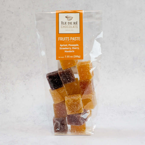 Assortments of Fruit Paste Squares of the brand Ile De R?? Chocolats, arranged in a plastic bag, front view. 