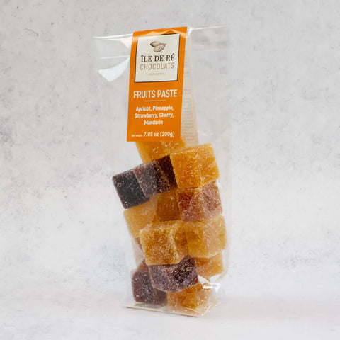 Assortments of Fruit Paste Squares of the brand Ile De R?? Chocolats, arranged in a plastic bag, side view. 