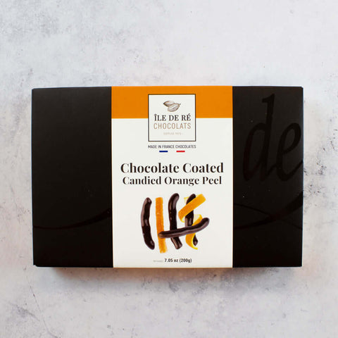Chocolate Coated Candied Orange Peel from Ile De R?? Chocolates, packed in their boxes, seen from above.