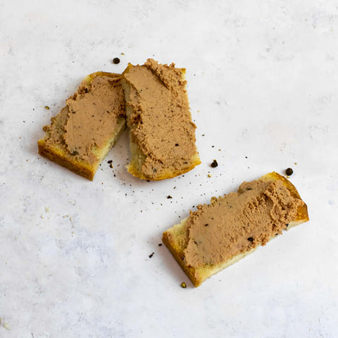 Chicken Liver w/ Black Truffles (Mousse Royale) toasted on 3 slices of bread, seen from above.