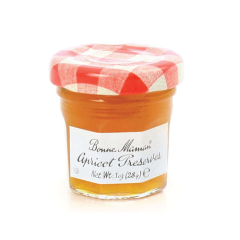 Glass jar of Apricot Preserves from the Bonne Maman brand, seen from the front.