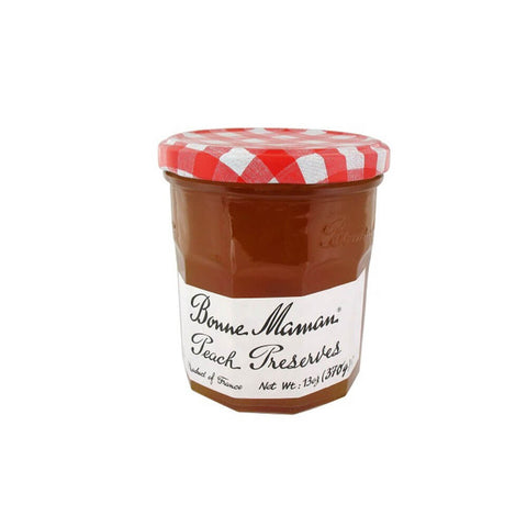 Glass jar of Peach Preserves from the Bonne Maman brand, front view.