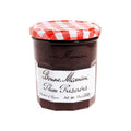 Glass jar of Plum Preserves from the Bonne Maman brand, seen from the front.