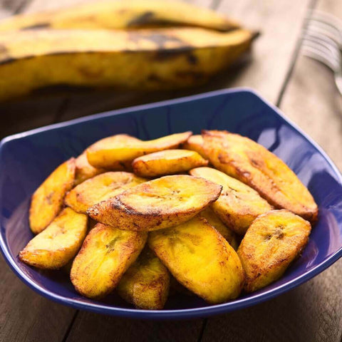 Assortment of Sweet Plantain cooked in a round plate, front view.