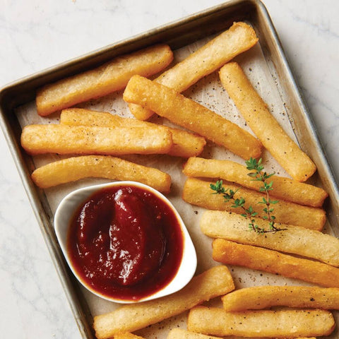 Assortment of Yuca Steak-Cut set on a tray with ketchup, seen from above.