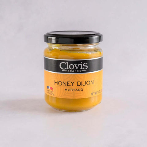 Honey Dijon Mustard from Clovis France, in a glass jar, front view. 