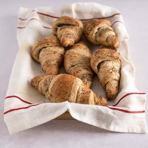 6 Vegan Chia Seed Croissants baked placed in a basket, top view.