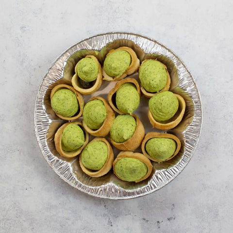 12 Escargot Croquilles not yet cooked in an aluminium dish, seen from above.