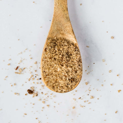 Wooden spoon containing Fleur de sel with Roasted Spices, seen from above.