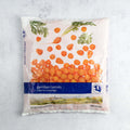 Plastic bag containing an assortment of Parisian carrots, top view. 