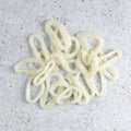 Argentinian Calamari Rings arranged on marble, seen from above.