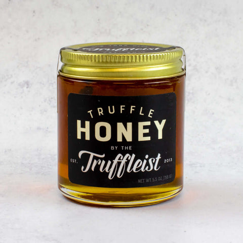 Truffle Honey from Truffleist brand, in a glass jar, front view. 