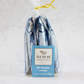 Milk Chocolate Sardine of the brand Ile De Ré Chocolats, packed in their plastic bag, front view.
