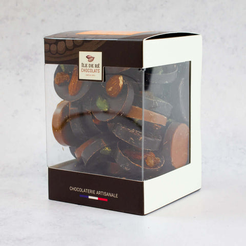 Chocolate Mendiants Dark/Milk Assortment of the brand Ile de R?? Chocolats, arranged in their boxes, side view. 