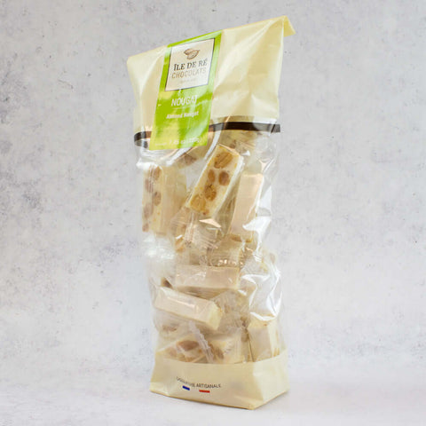Assortments of Nougats of the brand Ile De Ré Chocolats arranged in a plastic bag, side view. 