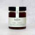 Honey - Pine of the Kalios brand in its glass jar, front view. 