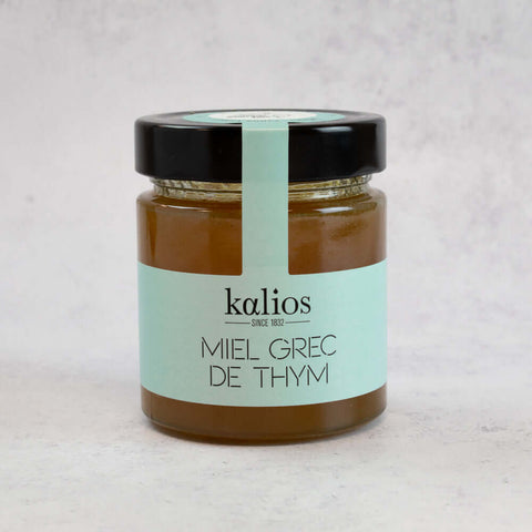 Honey - Thyme of the Kalios brand in its glass jar, front view. 