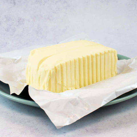 The Gall Butter Block Salted opened and arranged on a plate, side view. 