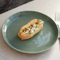 French Quenelle Buns arranged in a round plate, seen from above. 