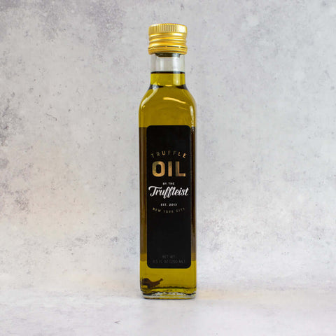 Black Truffle Oil from Truffleist brand, in its glass bottle, front view. 