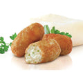 3 Cod Croquettes posed with some basil leaves, front view.